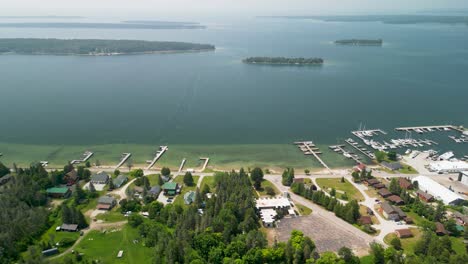 Aerial-back-view-of-Hessel-Michigan,-Les-Cheneaux-Islands,-Lake-Huron