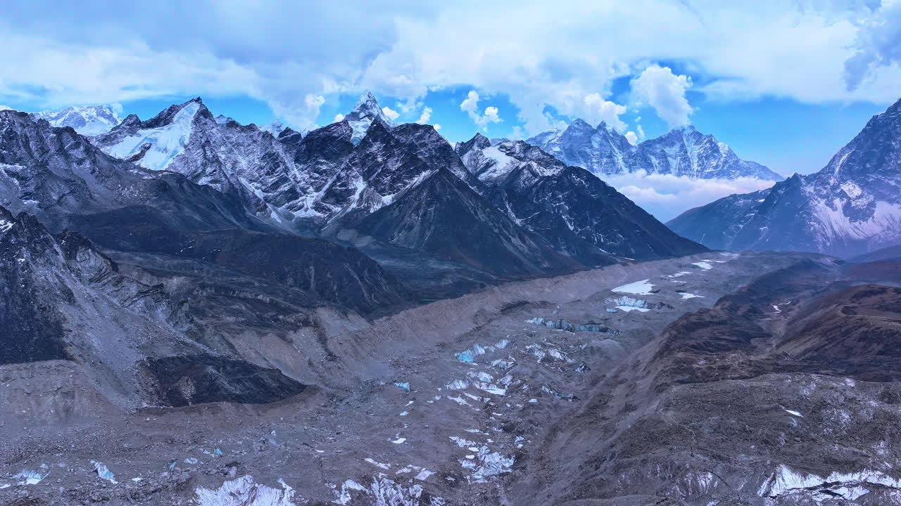 Aerial timelapse from Kala Patthar at Everest Base Camp, Nepal. Cloudy skies, less snowfall, and panoramic Himalayan views reveal climate change, high-altitude topography, and painting-like scenery