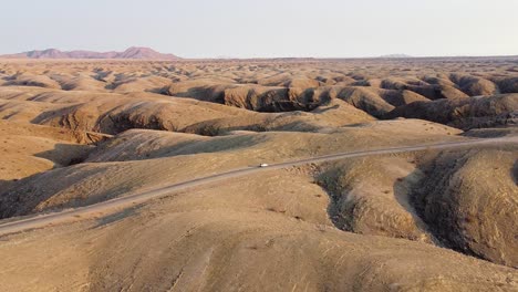 Namibian-self-drive-wildlife-adventure-with-a-rooftop-tent-equipped-Toyota-Hilux-on-the-rugged-landscape-of-Kuiseb-Pass