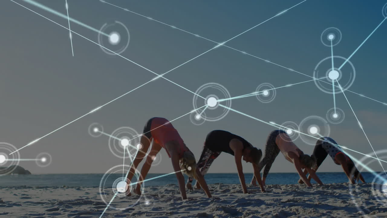 Women practicing yoga on beach with network connections animation overlay