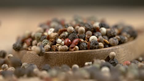 Mixed-peppercorns-in-a-super-slow-motion.-Dry-mix-peppercorns-close-up.