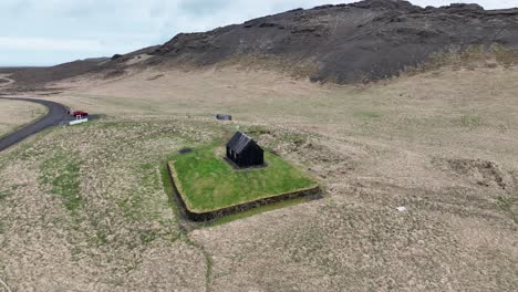 aerial orbit on old historical church of krysuvik in reykjanes, south iceland