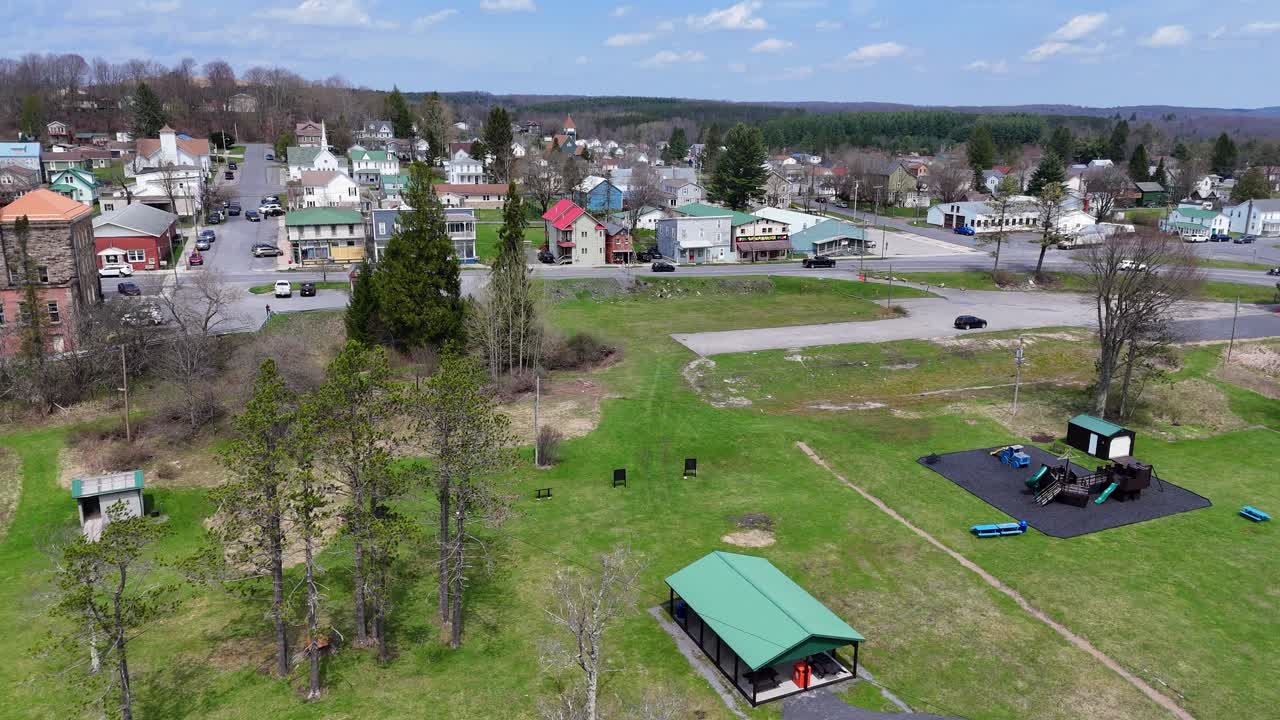Riverside park with playground and trees along Blackwater River in Davis, WV, USA