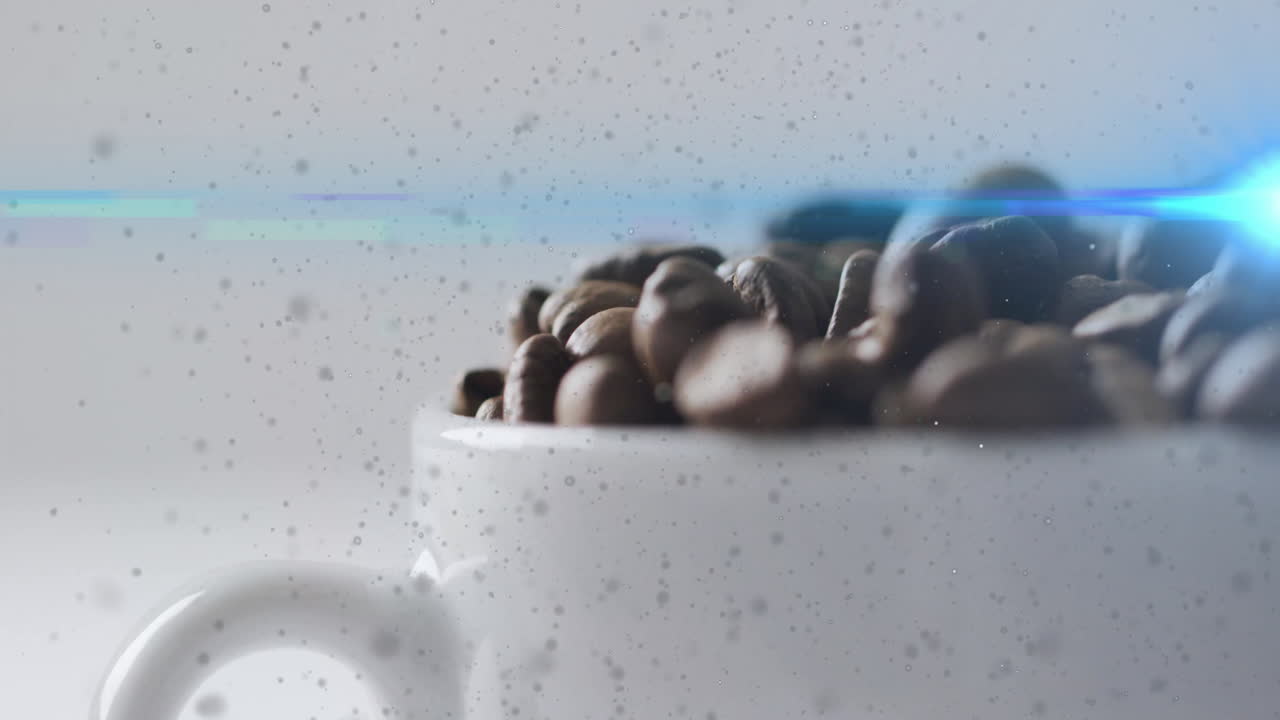 Coffee beans sitting inside white ceramic cup, showing shallow focus macro with blue lens flare