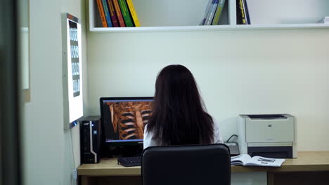 doctor reviewing medical images in an office