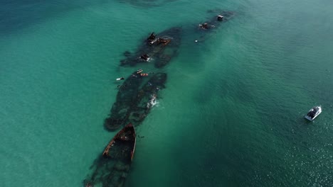 Top-down-footage-of-diving-excursion-taking-place,-shipwrecks-Australia