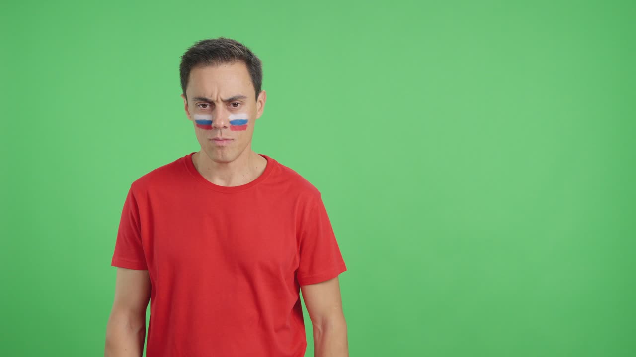 Dignified and serious man with russian flag painted on face