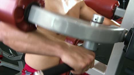 man working out on gym equipment