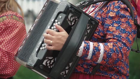 Woman-dressed-in-a-folk-costume-plays-the-accordion-2