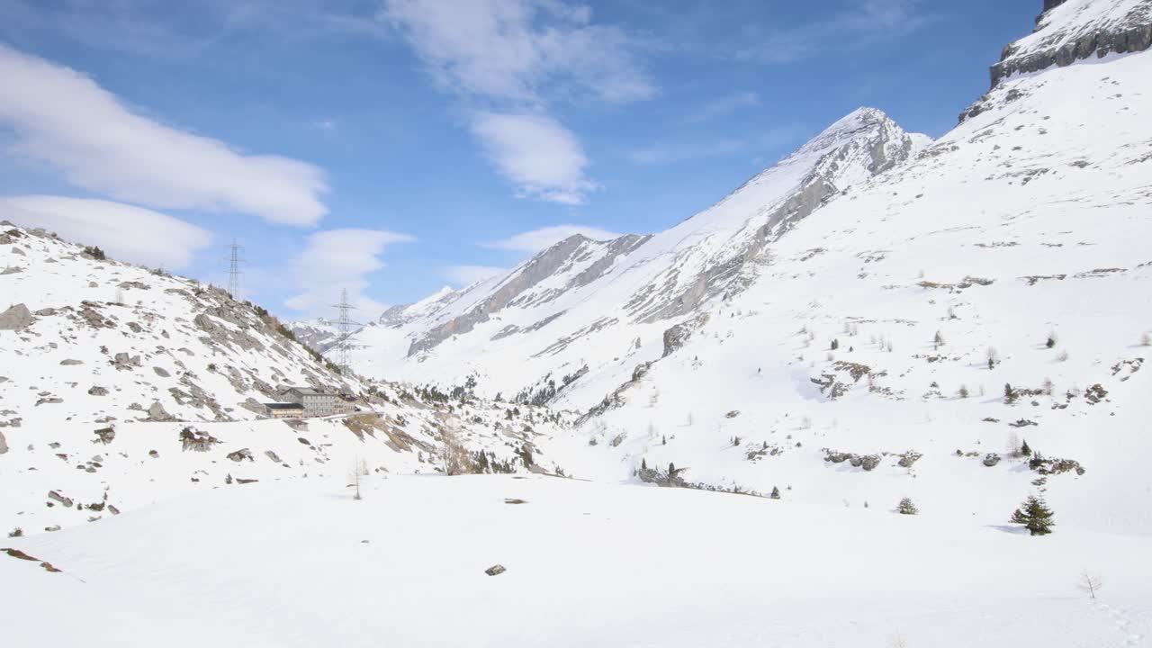 Winter mountain pass with hotel near Gemmi pass in Swiss alps, landscape establisher