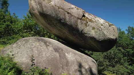 huge granitic boulders resting on steep slopes at pena do equilibrio in ponteareas, pontevedra, spain