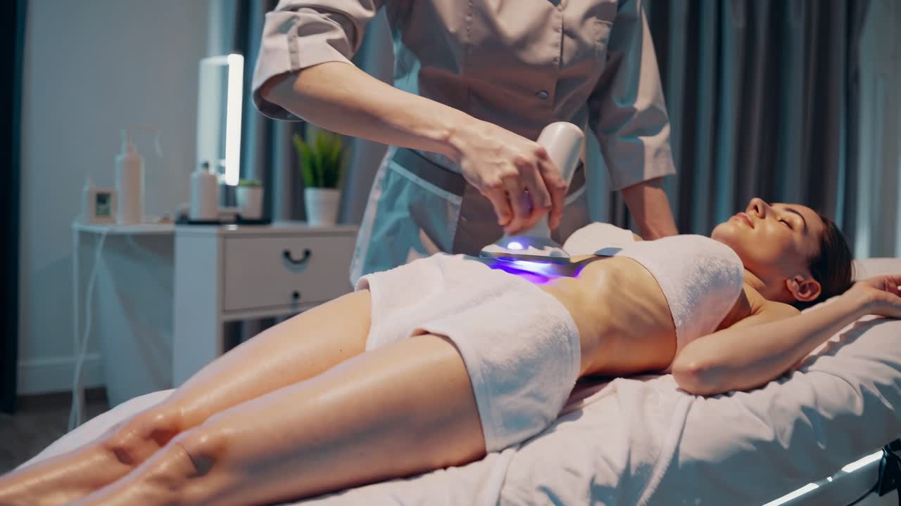 Woman undergoing body treatment at a spa
