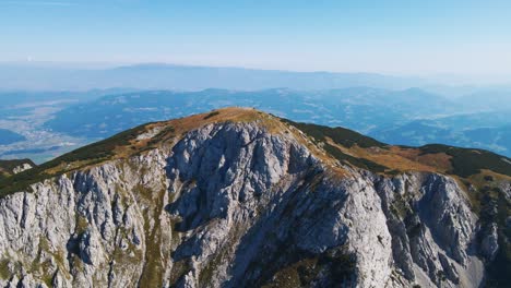 Stunning-4K-drone-footage-of-Saddle-bellow-Kordezeva-Glava---Peca-mountain-in-Karavanke-mountain-range