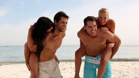women doing piggy back on their boyfriends