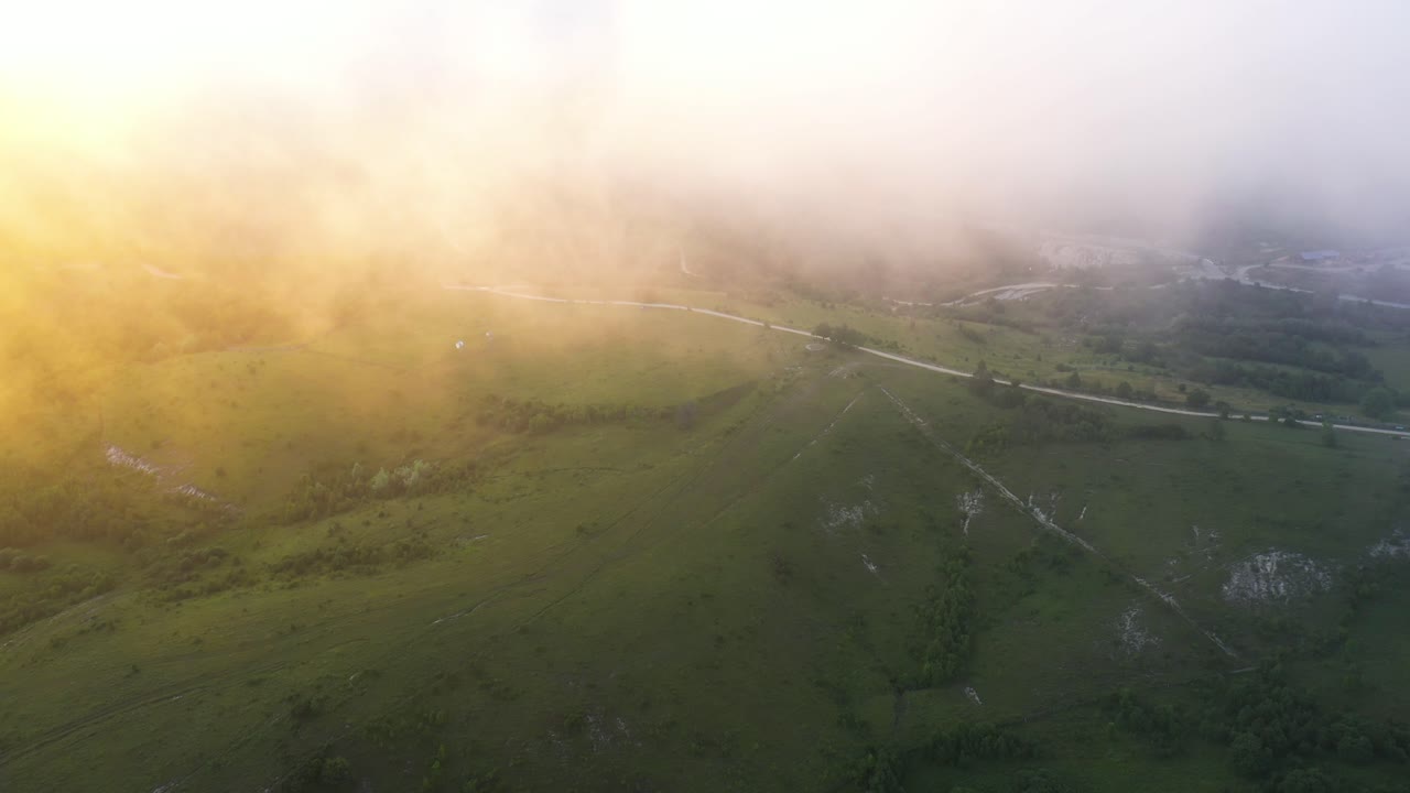 Sun Rays And Clouds Over The Lush Green Mountain In Racha, Georgia On An Early Morning - aerial