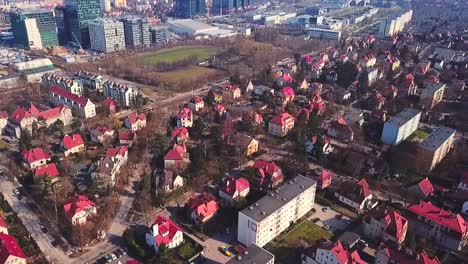 drone flying forward above the red houses province