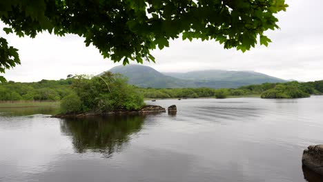 panning wide view of lake mountain landscape in killarney, ring of kerry