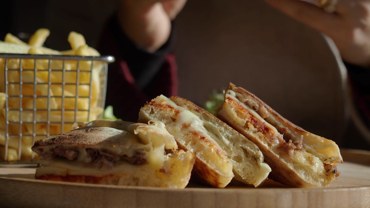 Appetizing Grilled Sandwich with Melted Cheese and French Fries