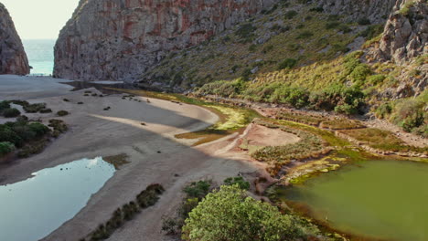 torrent de pareis river gorge at sa calobra beach in escorca, balearic islands, spain