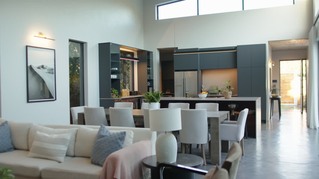 Modern kitchen and dining area with stylish furniture and natural light, copy space
