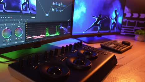 video editing workstation with monitors and controls