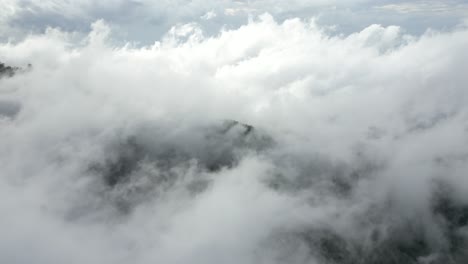 clouds moving over the tops of mountains in the north of bali, indonesia