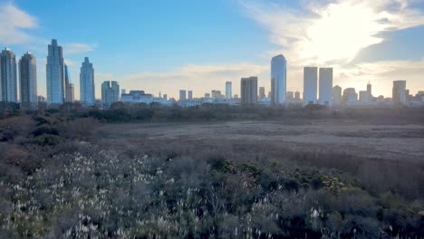 4k aerial drone footage with cityscape views of puerto madero during sunset over the skyline in argentina