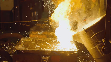 explosive metal casting in foundry, shower of sparks from molten metal