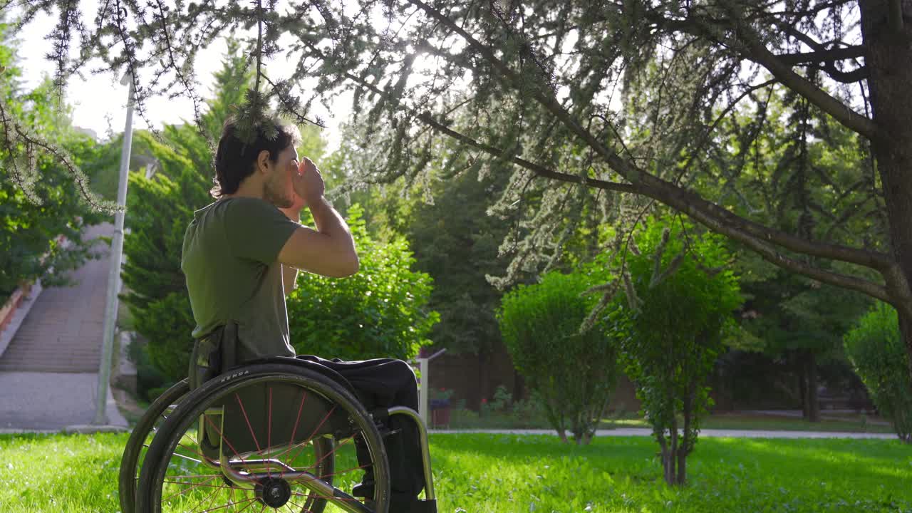 Disabled youth sitting in a wheelchair praying.