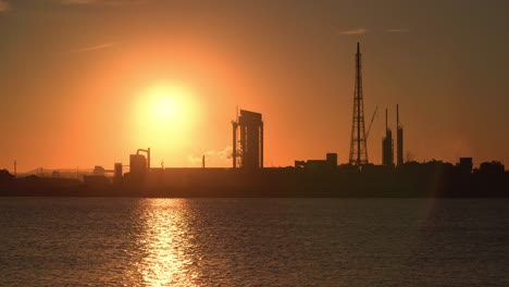 oil refinery factory at sunset