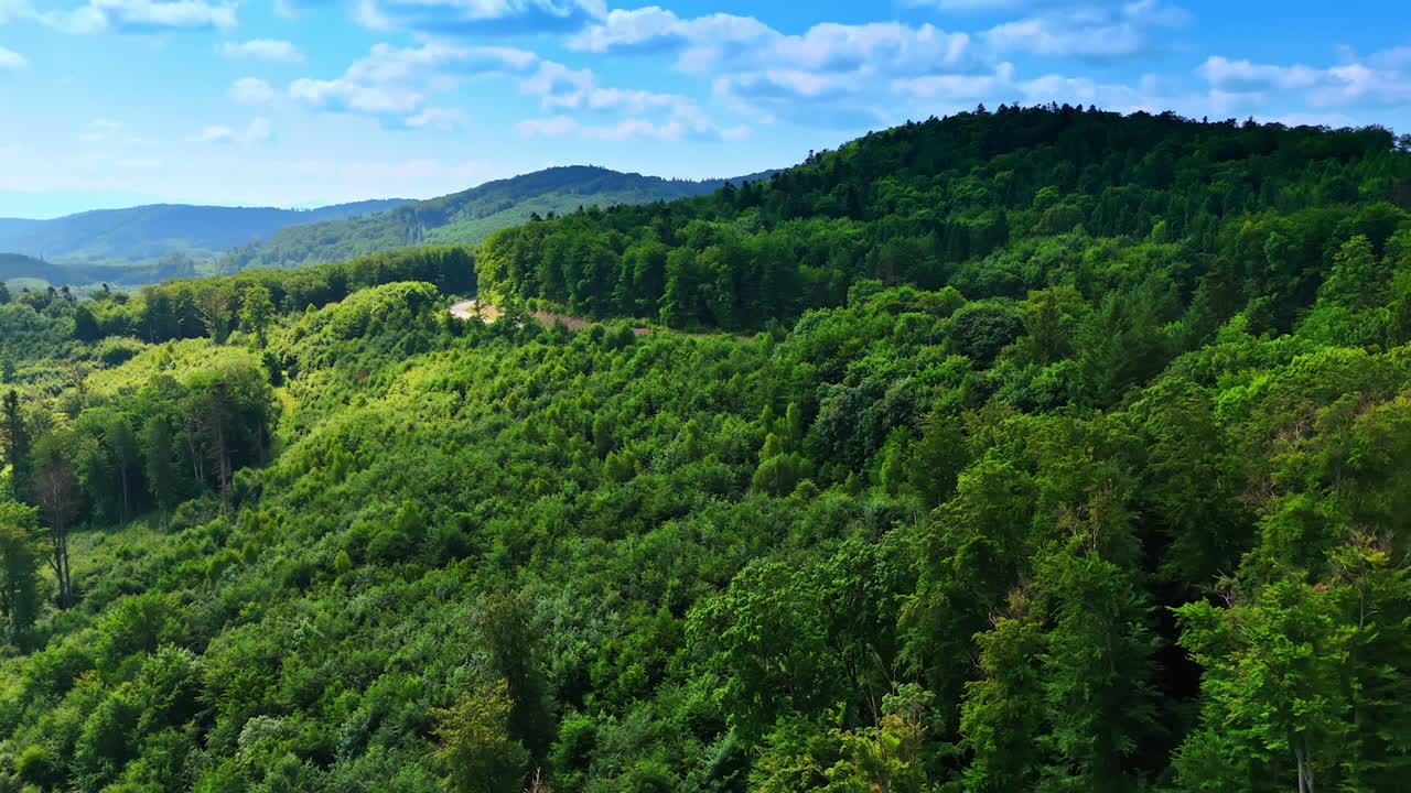 Vibrant green landscape, blue sky. Vibrant green hills stretch under a bright blue sky, showcasing nature's beauty and serenity in this lush landscape