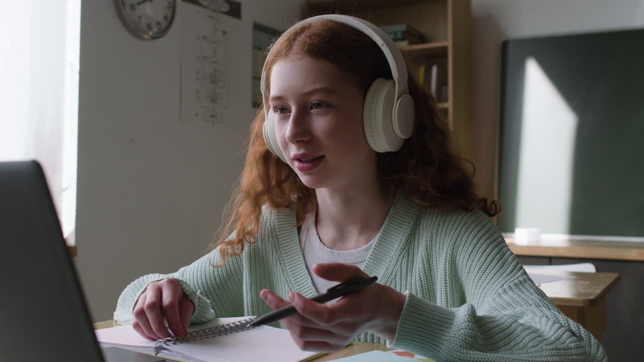 Teenage Girl Participating in Online Class