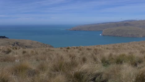 Fingers-of-land-from-extinct-volcano-slope-gently-towards-ocean---Banks-Peninsula,-New-Zealand