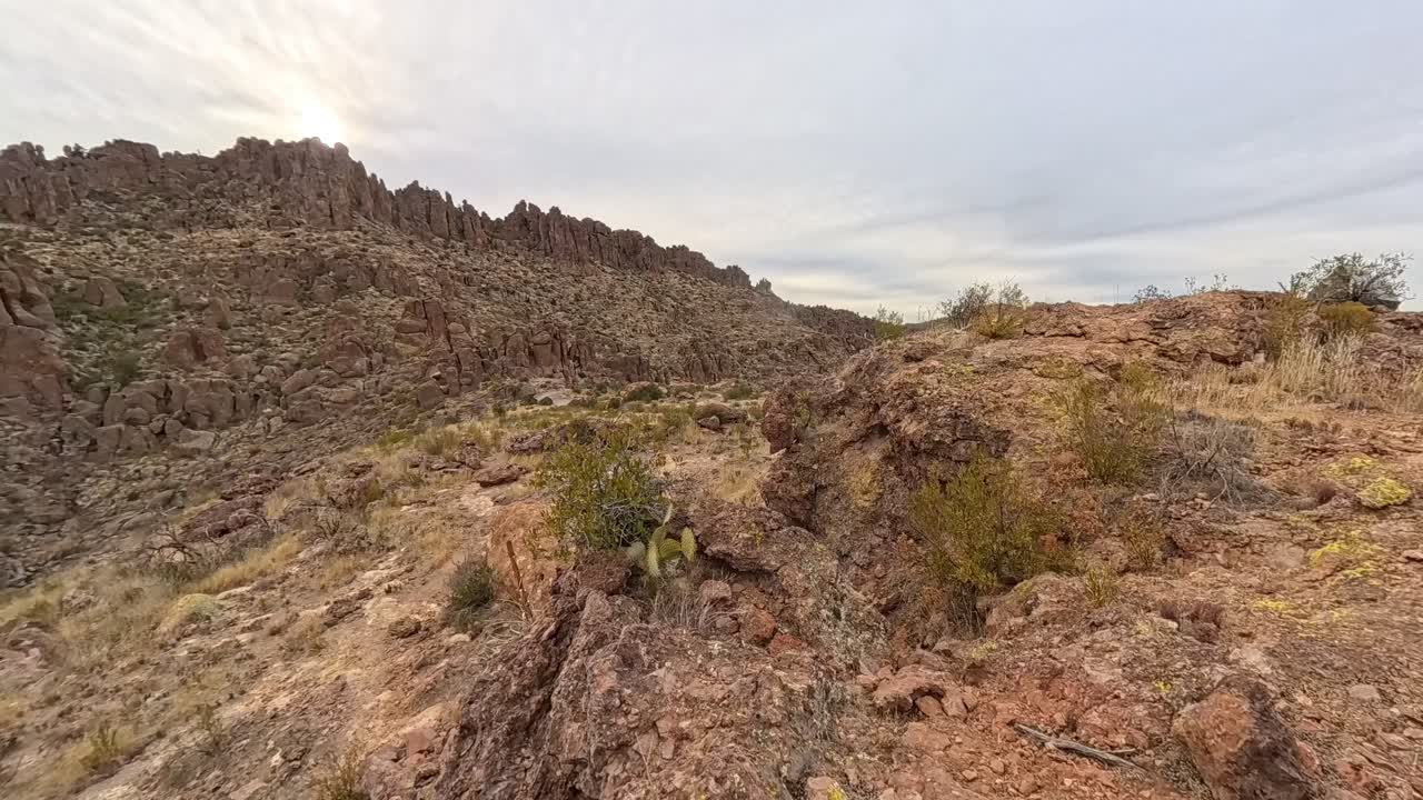 Sun Cloud Time Lapse hiker explores in the Superstition Mountains