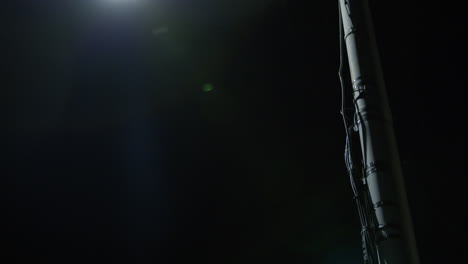 tilt down a street light at night in a quiet neighbourhood in new zealand