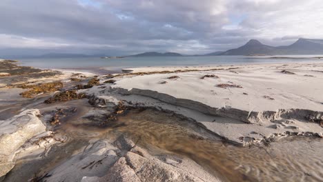 A-shallow-stream-flows-through-the-sandy-beach-and-connects-with-the-sea