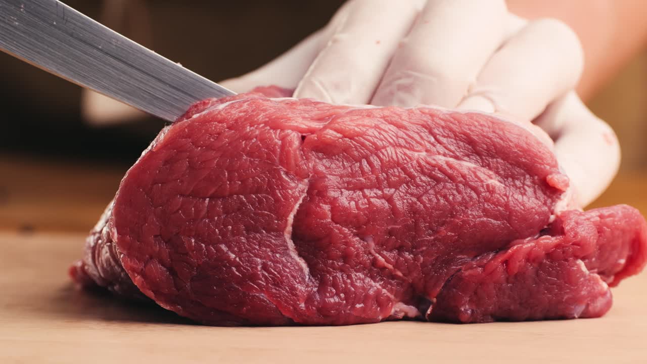 Cutting Raw Beef Steak