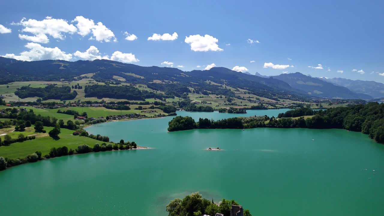 Lake Gruyère Le Bry small island Switzerland aerial drone turquoise blue water