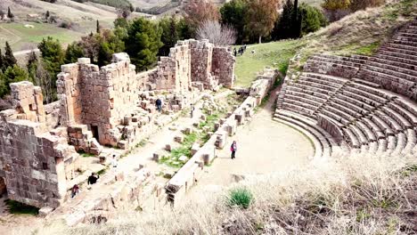 Unveil-the-ancient-secrets-of-Djemila-Roman-Site-with-this-stunning-aerial-footage,-showcasing-the-impressive-theater-and-temple-ruins