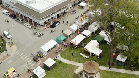 AERIAL---Booths-at-Dogwood-Festival,-Siloam-Springs,-AR,-top-down-tilt-up