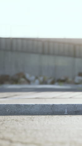 close-up of a concrete curb with a blurred background of a street