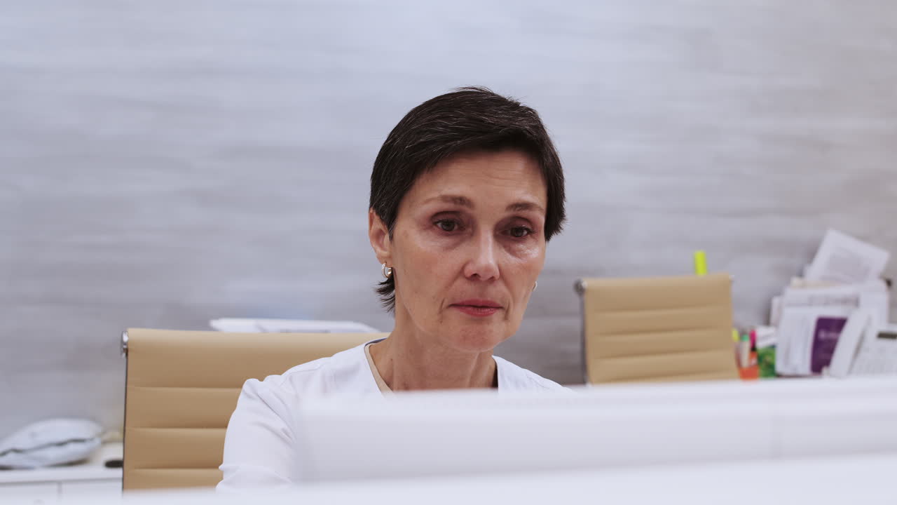 Doctor typing on computer