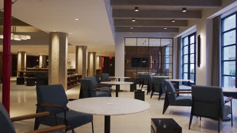 tables and chairs in empty furnished business lobby interior