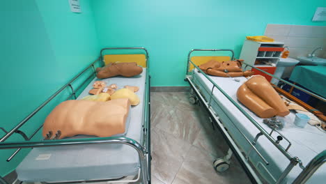 mannequin models in hospital beds. plastic dummy parts of patient's body to perform practice exercises in training room in the university. faculty of health.
