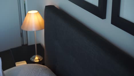 luxury modern boutique hotel room - close up of bed, pillow, cushion, lamp