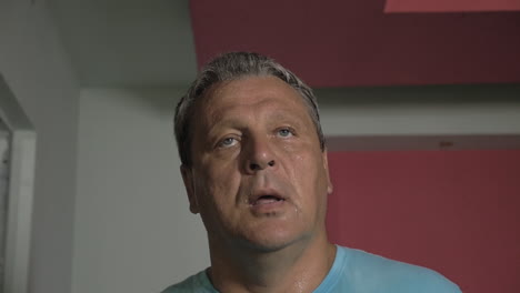 sweaty man having a workout at treadmill