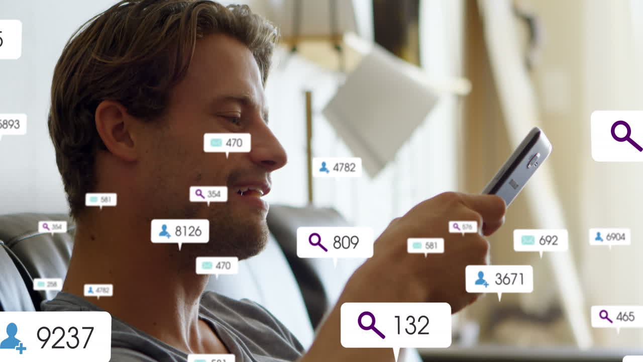 Animation of changing numbers, icons in notification bars, caucasian man looking at smartphone