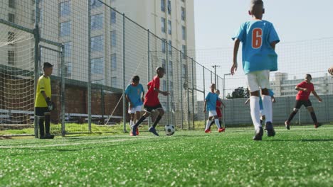 soccer kids playing in a sunny day