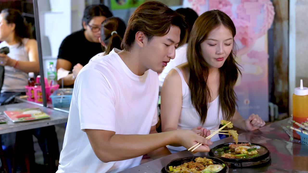 Couple eating street food