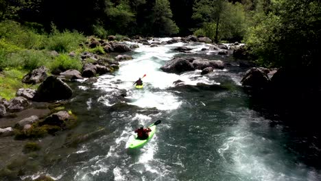 aerial view of whitewater kayaker running class iv rapids on the mill creek section of the rogue river in southern oregon